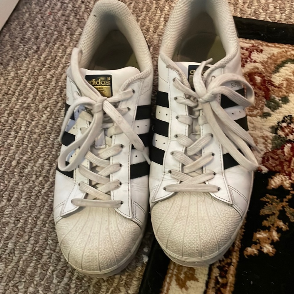 Adidas tennis shoe.